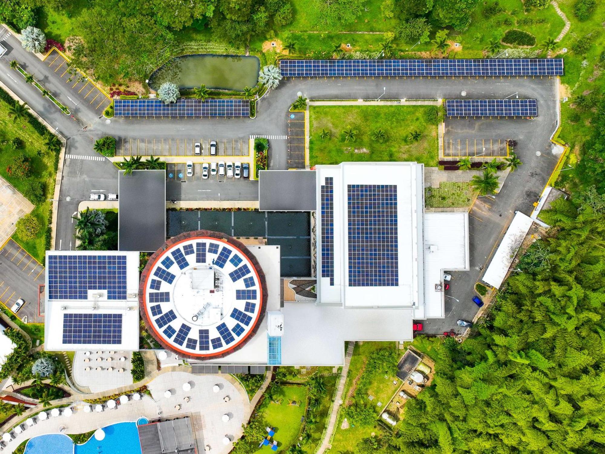Sonesta Hotel Pereira Cerritos Exterior photo Solar panels on the roof of the school